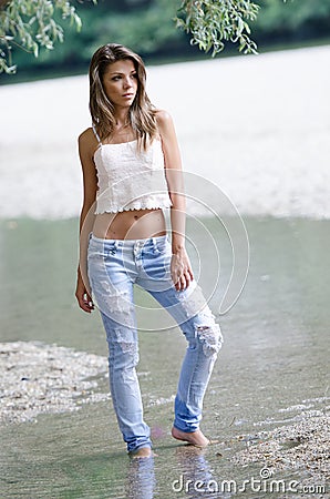 Pretty woman in the beautiful scenery at the river Stock Photo