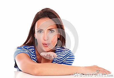 Pretty woman in blue t-shirt blowing a kiss Stock Photo