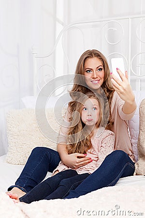 Pretty woman and child taking a selfie Stock Photo