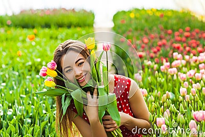 Pretty woman choosing flowers Stock Photo