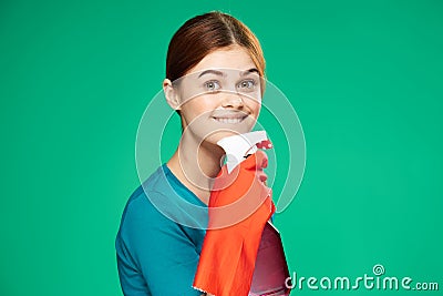 pretty woman with detergent cleaning service green background Stock Photo