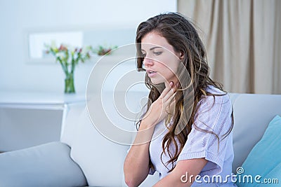 Pretty woman doing asthma crisis Stock Photo