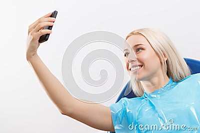 Pretty woman doing selfie at dentist Stock Photo