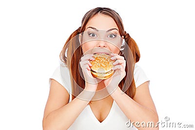 Pretty woman eating burger with gusto Stock Photo
