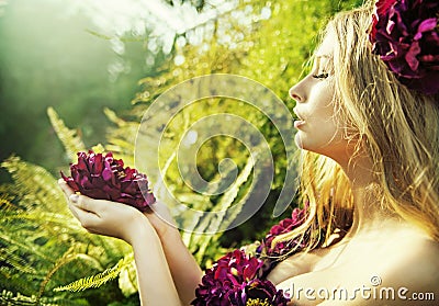 Pretty woman with gorgeous flower Stock Photo