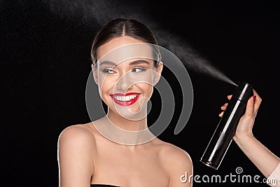 Pretty woman with hairspray Stock Photo