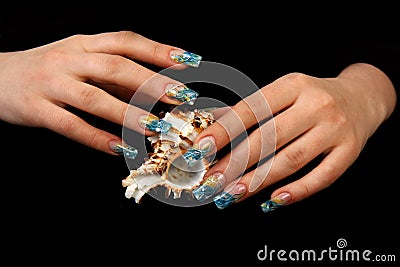 Pretty woman hand with perfect painted nails on black background Stock Photo