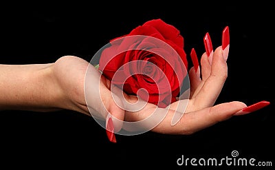 Pretty woman hand with perfect painted nails on black background Stock Photo