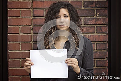 Pretty Woman Holding Blank Sign or Paper Stock Photo