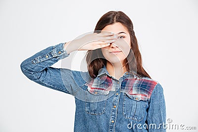 Pretty woman in jeans shirt covered one eye by hand Stock Photo