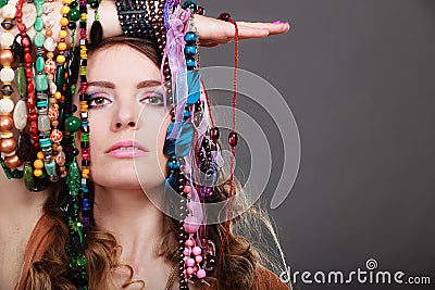 Pretty woman with jewelry necklaces bracelets Stock Photo