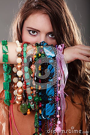 Pretty woman with jewelry necklaces bracelets Stock Photo