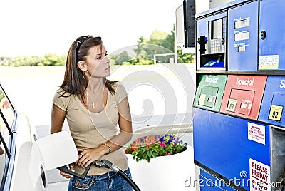 Pretty Woman Pumping Gas Stock Photo