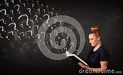 Pretty woman reading a book with question marks coming out from Stock Photo