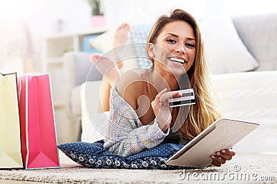 Pretty woman shopping online with credit card Stock Photo