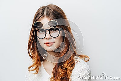 pretty woman in white sweater fashion glasses studio attractive hair Stock Photo