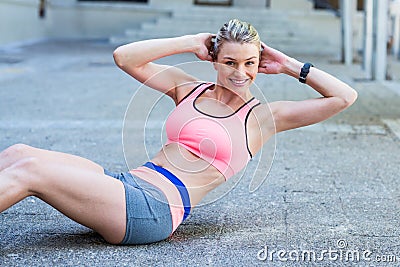 Pretty woman working on her abs Stock Photo