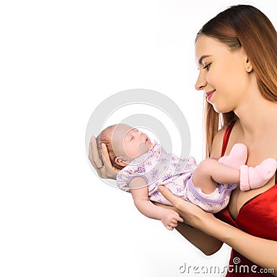 Pretty woman holding a newborn baby in her arms. Copy space, free space for your text Stock Photo