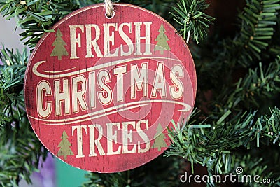 Pretty wood ornament that spells out `Fresh Christmas Trees` Stock Photo