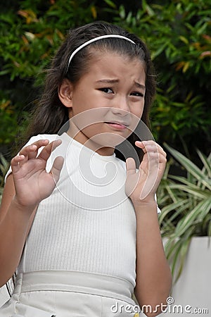 A Fearful Cute Philippina Youth Stock Photo