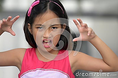 Intimidating Cute Minority Girl Stock Photo