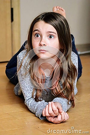 Pretty young brown hair girl surprised Stock Photo