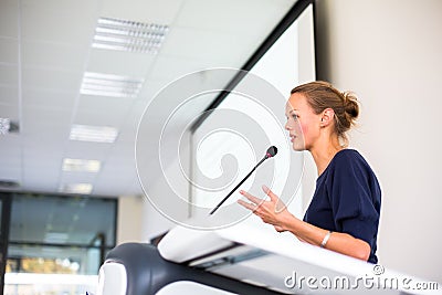 Pretty, young business woman giving a presentation Stock Photo