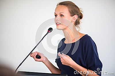 Pretty, young business woman giving a presentation Stock Photo