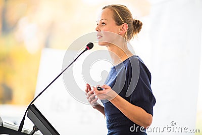 Pretty, young business woman giving a presentation Stock Photo