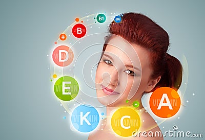 Pretty young girl with colorful vitamin icons and symbols Stock Photo