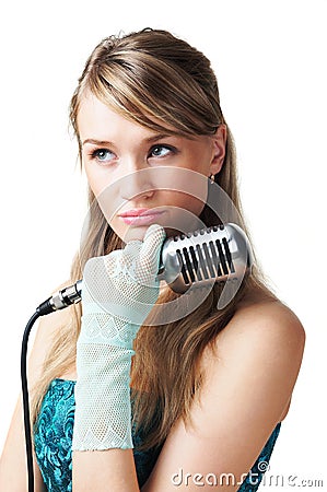 Pretty young girl holding retro microphone Stock Photo