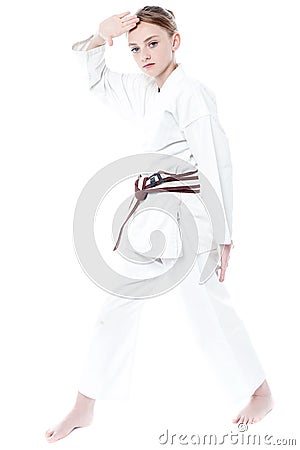 Pretty young girl in karate uniform Stock Photo