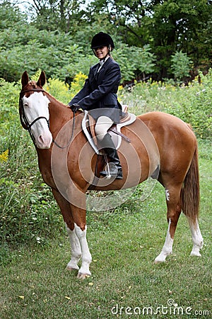 Pretty young girl showing her horse Stock Photo