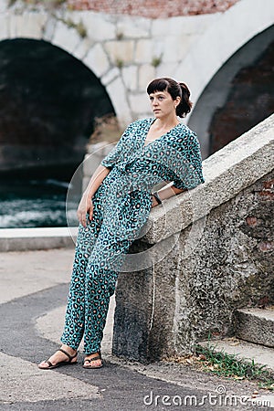 A pretty young girl spends time on the beautiful banks of the river Stock Photo