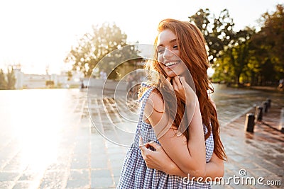 Pretty young redhead girl with long hair laughing Stock Photo