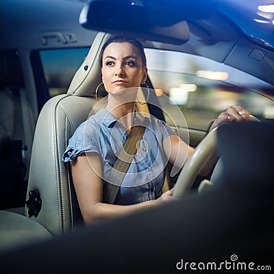 Pretty, young woman driving a car Stock Photo