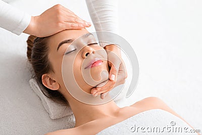 Face sculpturing procedure for pretty young woman Stock Photo