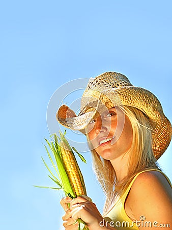 Pretty young woman holding corn Stock Photo