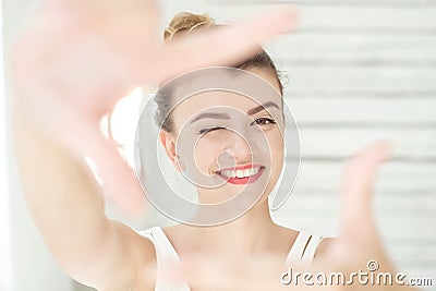 Pretty young woman making a frame gesture Stock Photo