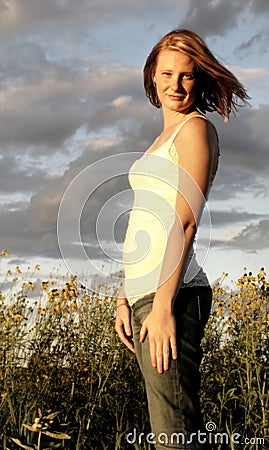 Pretty Young Woman in Meadow Stock Photo