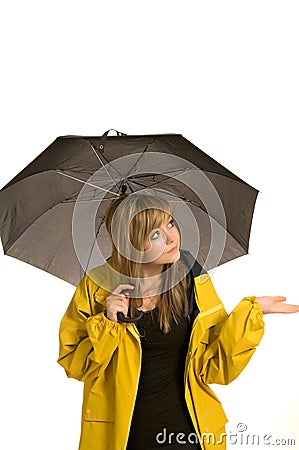 Pretty young woman in raincoat with umbrella Stock Photo