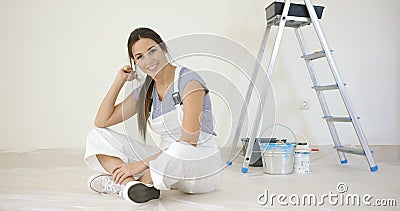 Pretty young woman renovating her home Stock Photo
