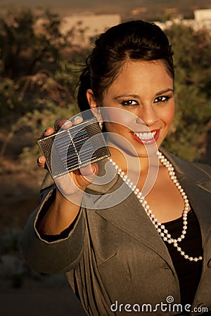 Pretty young woman with small solar panel Stock Photo