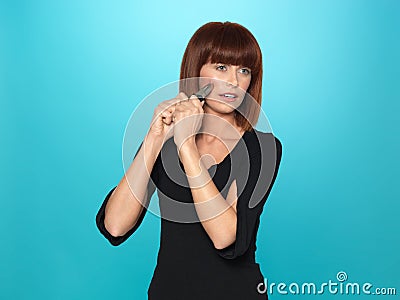 Pretty young woman squeezing a pumple Stock Photo