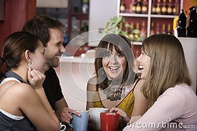 Pretty Young Woman Surrounded by Friends Stock Photo