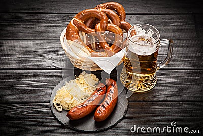 Pretzels, bratwurst and sauerkraut Stock Photo