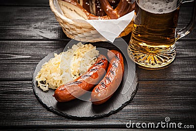 Pretzels, bratwurst and sauerkraut Stock Photo