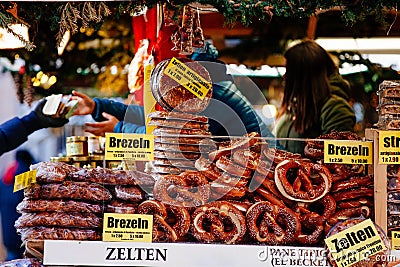 Pretzels and other bakery products for sale at Christmas market in Bolzano, Italy Editorial Stock Photo