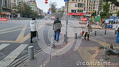 Shenzhen, China: prevent and combat the new coronavirus pneumonia on the streets, delivery couriers and some citizens Editorial Stock Photo