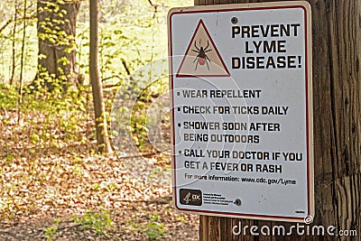 Prevent lyme disease from deer ticks warning sign Editorial Stock Photo